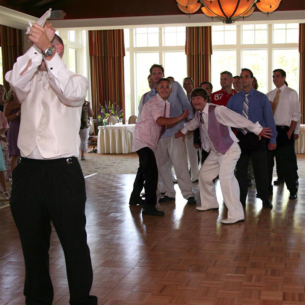 Garter toss at the wedding reception.
